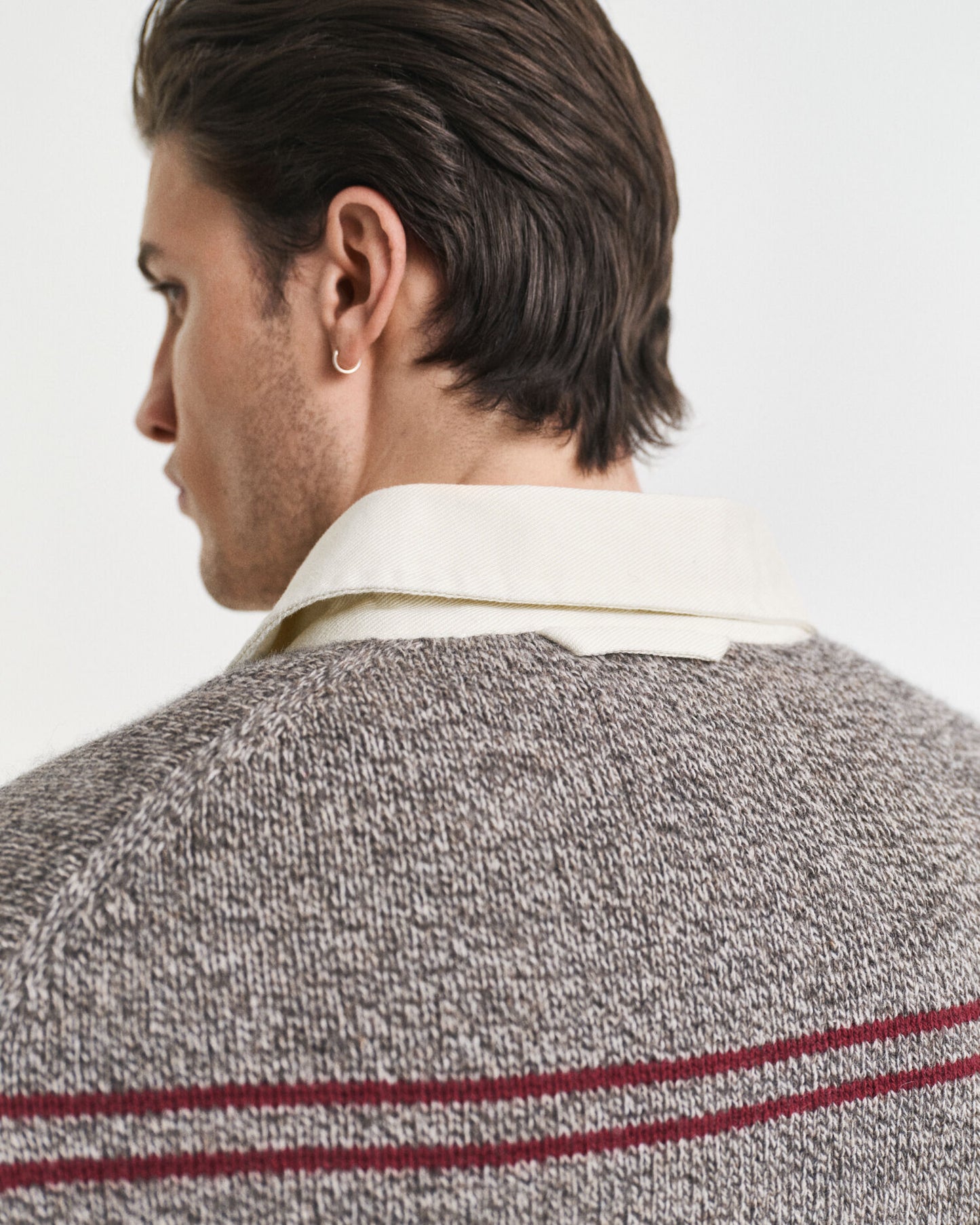 Pull polo en maille de laine mélangée à rayures